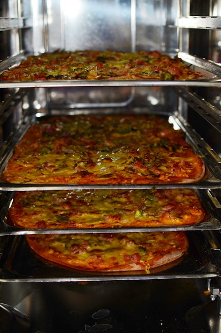 Professional catering team preparing food in a commercial kitchen